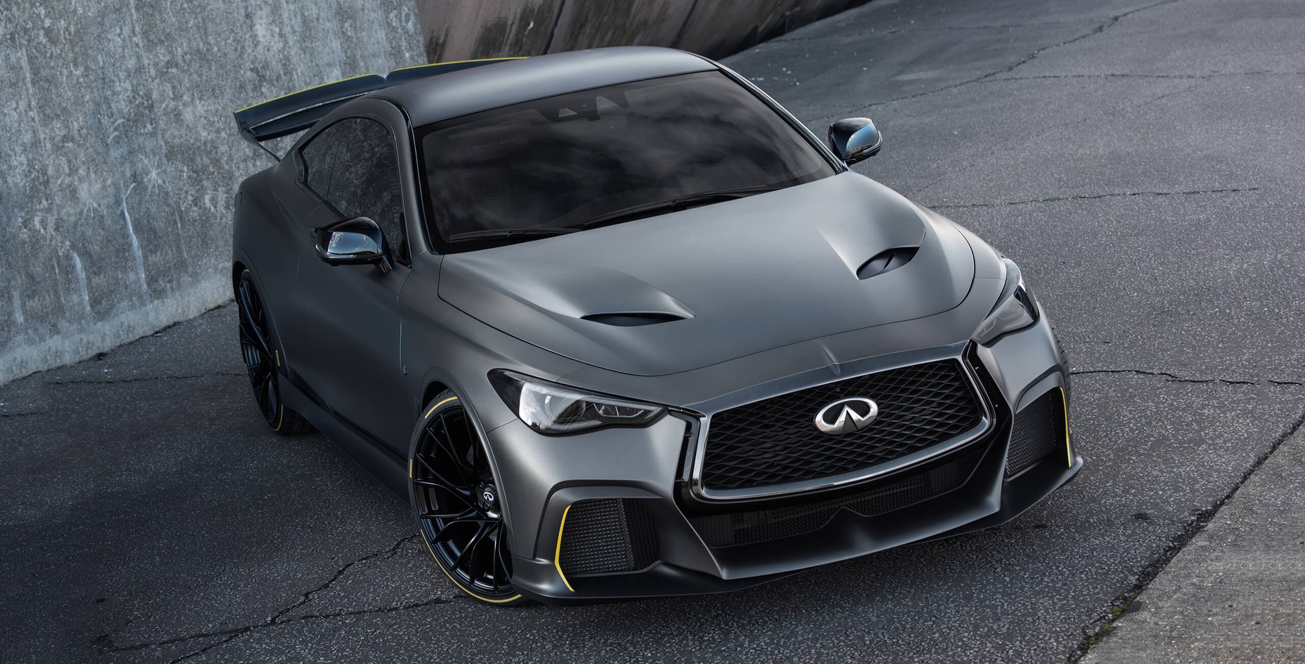  A front angled passenger's side view of the INFINITI Q60 Black S Sports Concept Car parked on asphalt